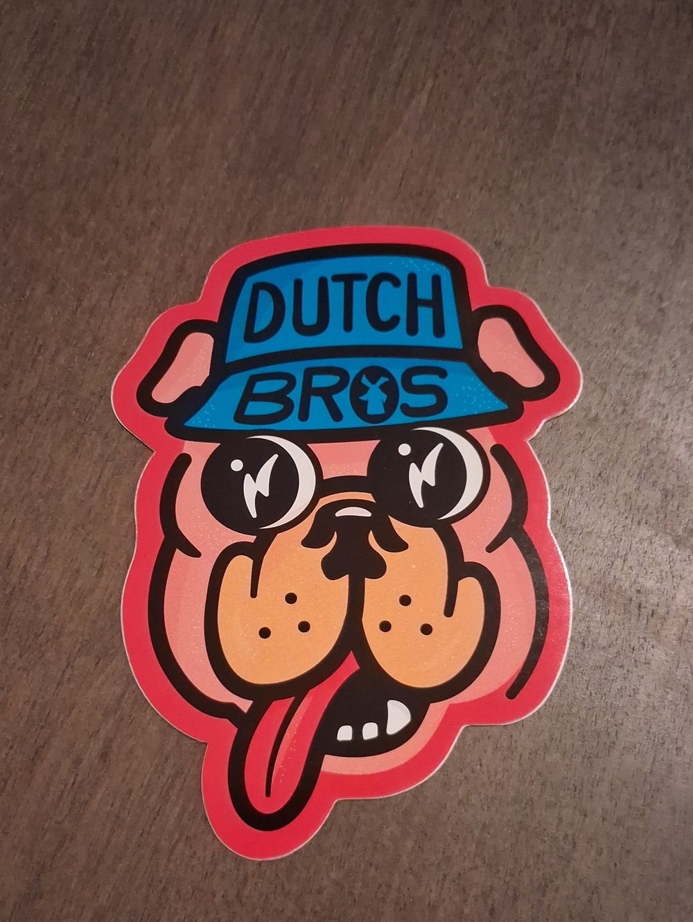 Dutch Bros Sticker featuring Blue Hat and Peach Dog